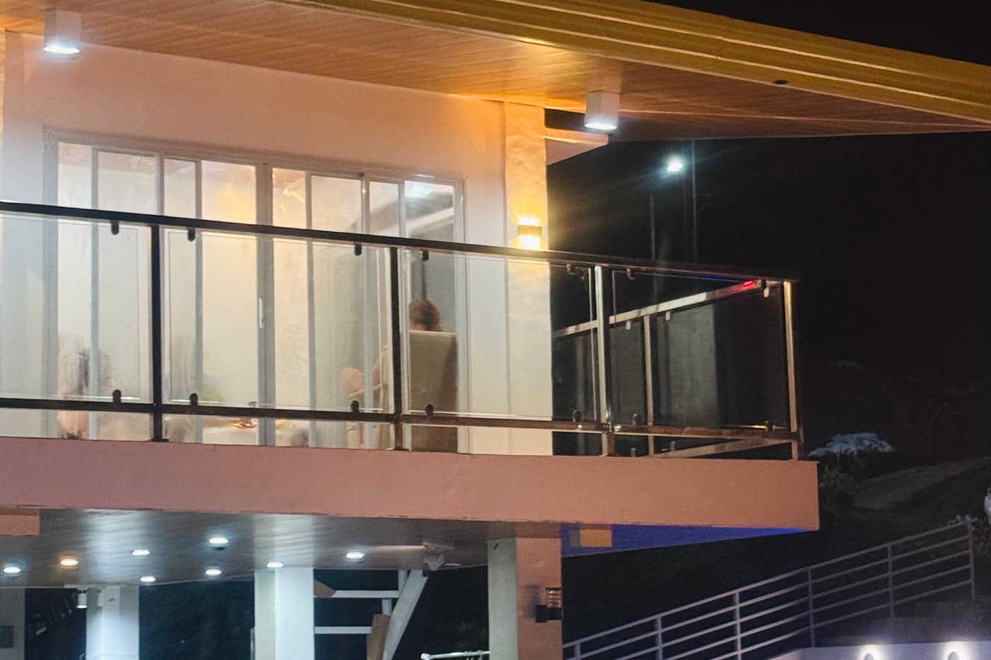 Glass balcony with warm lighting