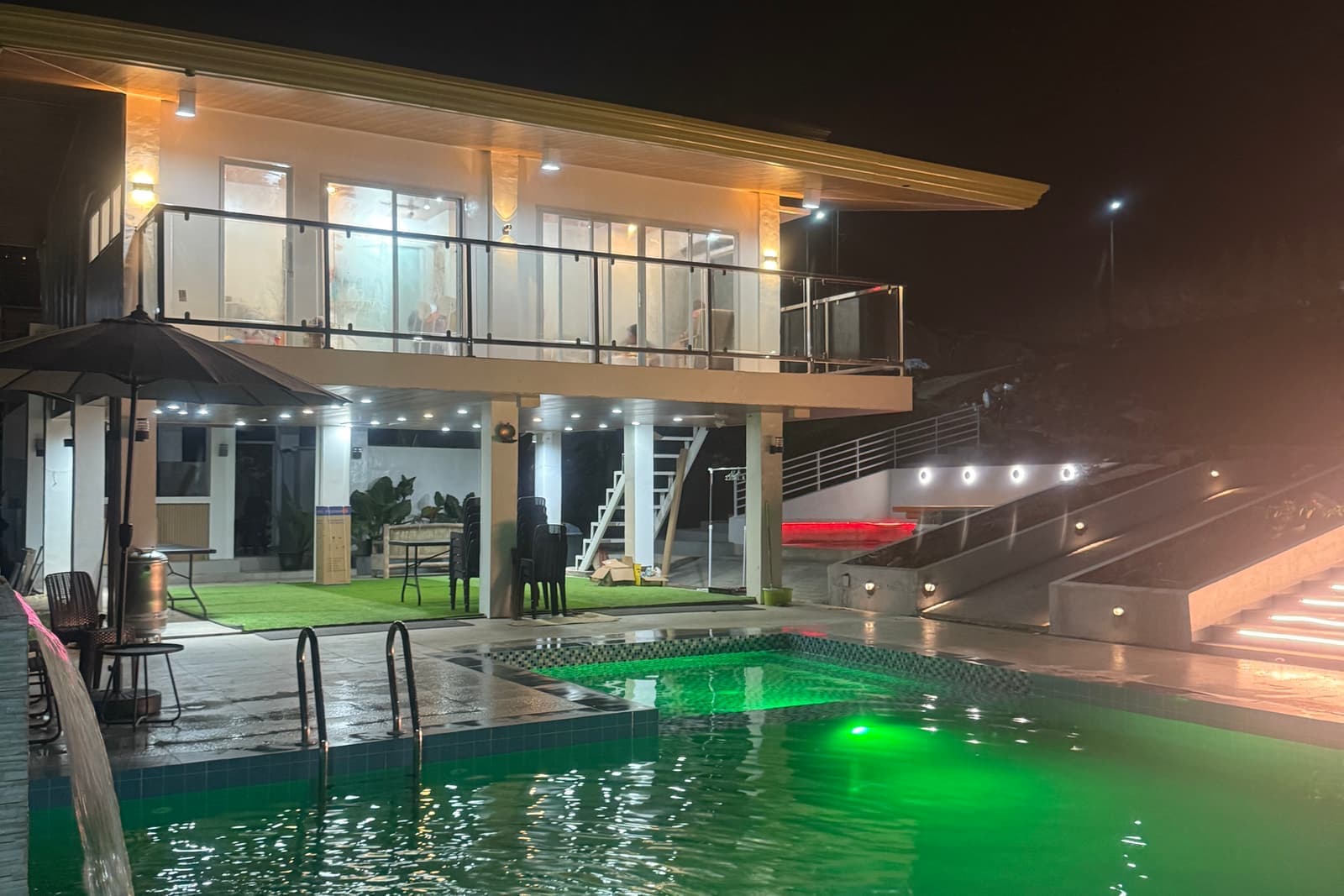 The two-storey modern farm house overlooking the pool